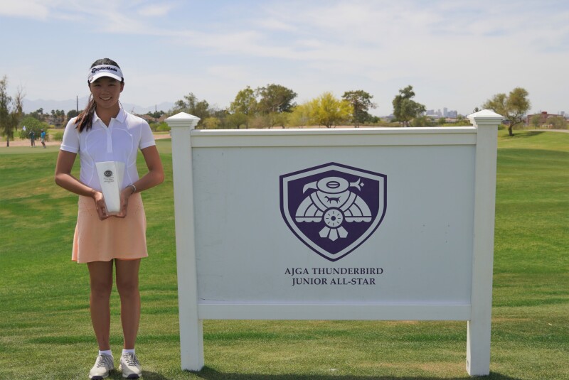 Nikki Oh trophy with signage.jpg