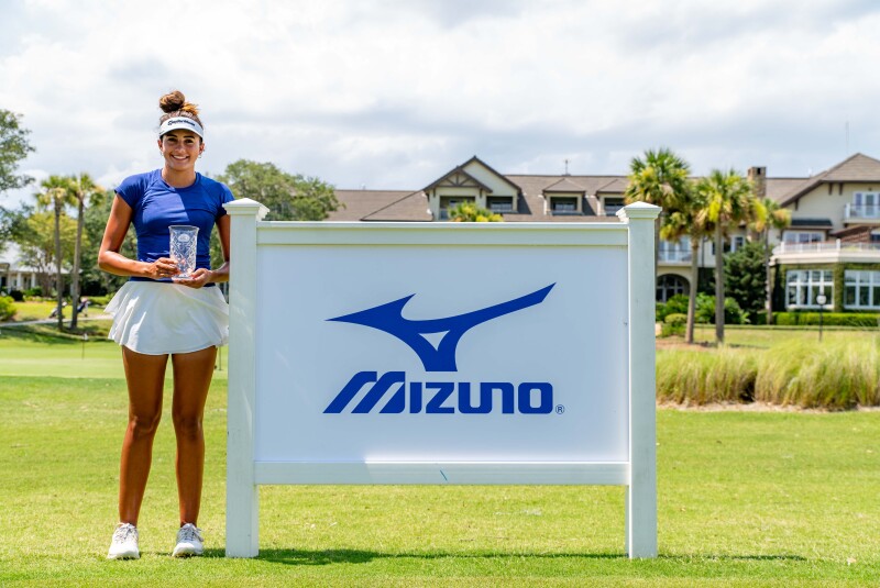 Charlotte Cantonis with trophy in front of Mizuno Banner- 2023 - Mizuno - Keith Junior Championship_-26.jpg