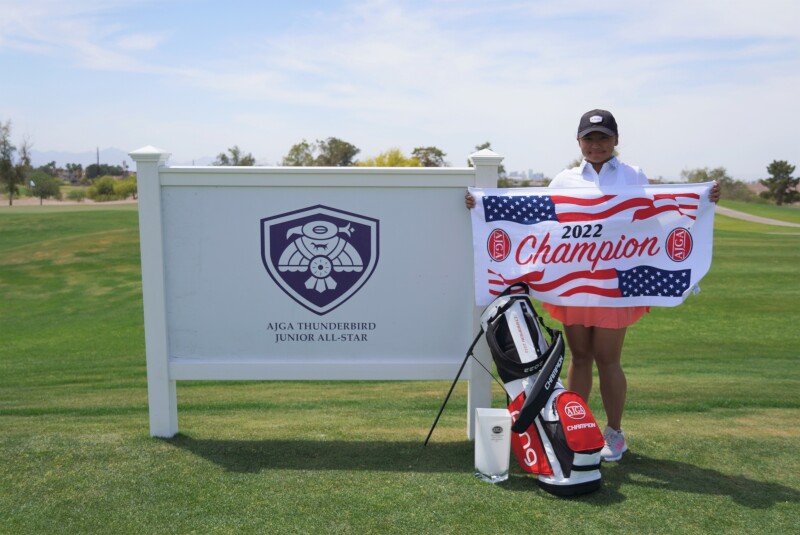 Rianne Malixi trophy with signage.jpg