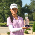 Keira Shavitranuruk with trophy in front of arch - 2026 - AJGA Junior All-Star Invitational