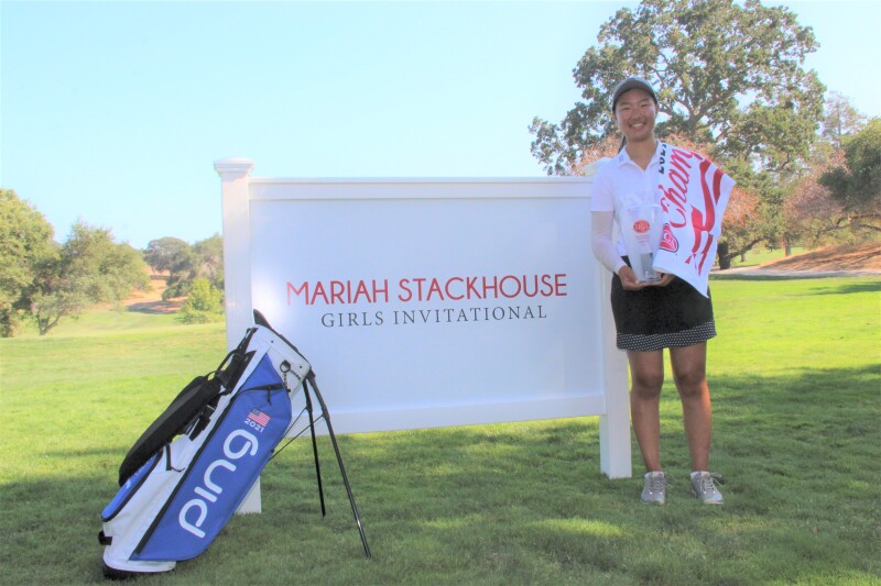 Michelle Liu Champ Bag trophy in front of signage - Mariah Stackhouse Girls Invitational - 2021